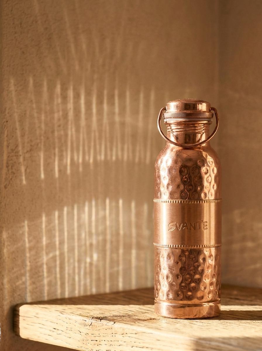 Lifestyle shot — tote bag and copper bottle